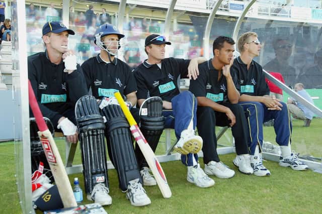 Hampshire players John Crawley, Simon Katich, Shaun Udal, Lawrence Prittipaul and Alan Mullally wait in the dugout during the first ever T20 Cup tie against Sussex in June 2003 at the Rose Bowl. Photo by Mike Hewitt/Getty Images.