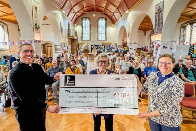 Di Lloyd, Chair of the Portsmouth Philharmonic presents a cheque for £778 to the Revd Canon Paul Gully, Rector of the of the parish and the Revd Deb Henning Vears, Assistant Curate.