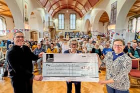 Di Lloyd, Chair of the Portsmouth Philharmonic presents a cheque for £778 to the Revd Canon Paul Gully, Rector of the of the parish and the Revd Deb Henning Vears, Assistant Curate.