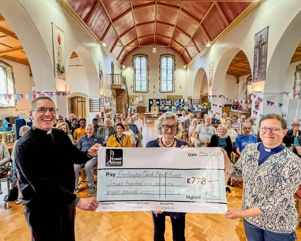 Di Lloyd, Chair of the Portsmouth Philharmonic presents a cheque for £778 to the Revd Canon Paul Gully, Rector of the of the parish and the Revd Deb Henning Vears, Assistant Curate.