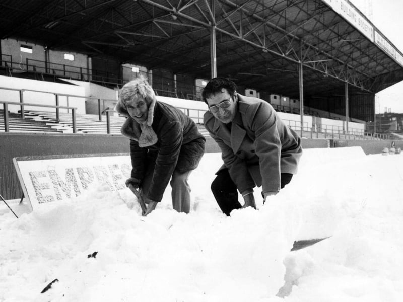Pompey Secretary Bill Davis and Commercial manager Les Allen clearing snow at Fratton Park, 1982. The News PP5739