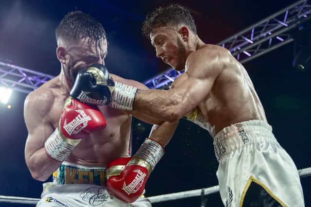 Michael Mckinson, right, is hoping to win his friends and supporters some cash when he fights the bookies' favourite Chris Kongo next month. Picture: Scott Rawsthorne MTK Global