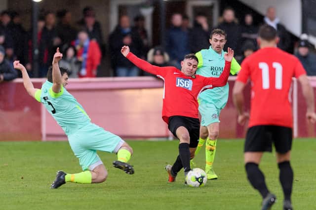 Jack Breed stretches for the ball during Fareham Town's FA Vase win against Roman Glass St George in December at Cams Alders. Picture: Keith Woodland