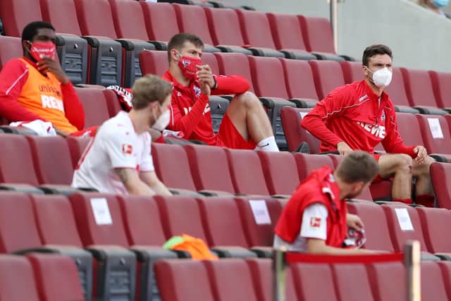 The FC Koln substitutes socially distance in the stands rather than the dugout for their Bundesliga game against FSV Mainz. Picture: Lars Baron/Getty Images