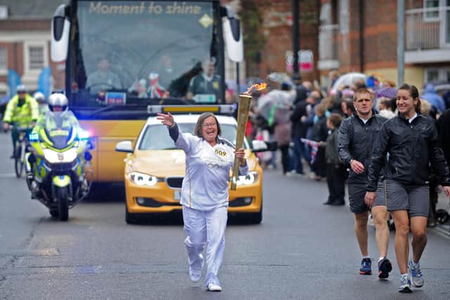 Flashback - Bronwin Carter carries the Olympic flame along Kingston Road in Portsmouth ahead of London 2012. Picture: Ian Hargreaves