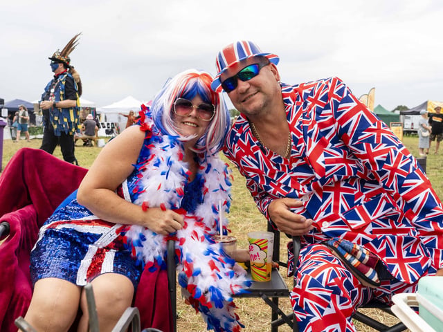 Two festival-goers get into the spirit of the festival.