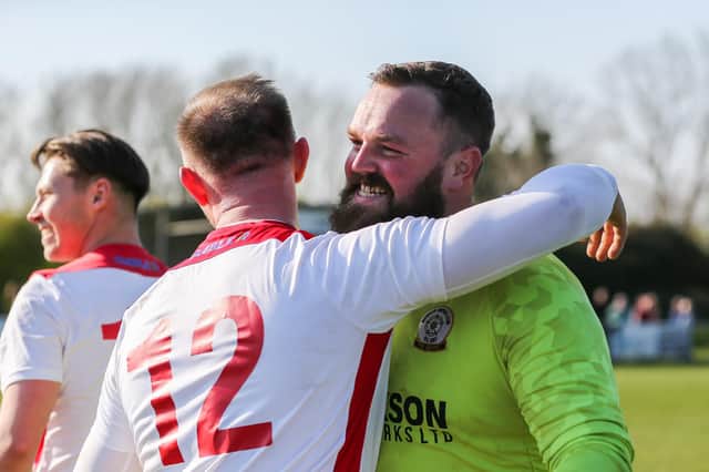 Horndean keeper Cameron Scott all smiles after the final whistle at AFC  Portchester. Picture by Nathan Lipsham