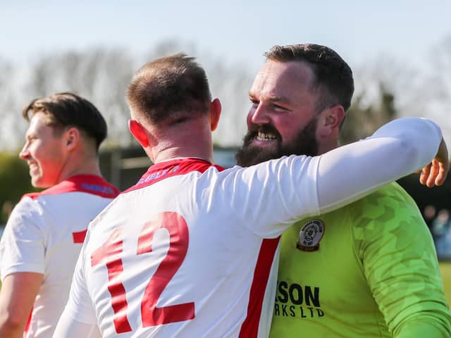 Horndean keeper Cameron Scott all smiles after the final whistle at AFC  Portchester. Picture by Nathan Lipsham