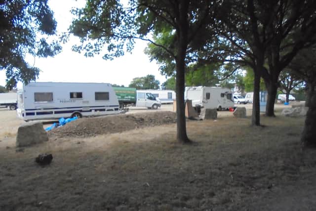 Travellers set up the illegal camp on Thursday after moving a defensive boulder, pictured front. Photo: Richard Coates