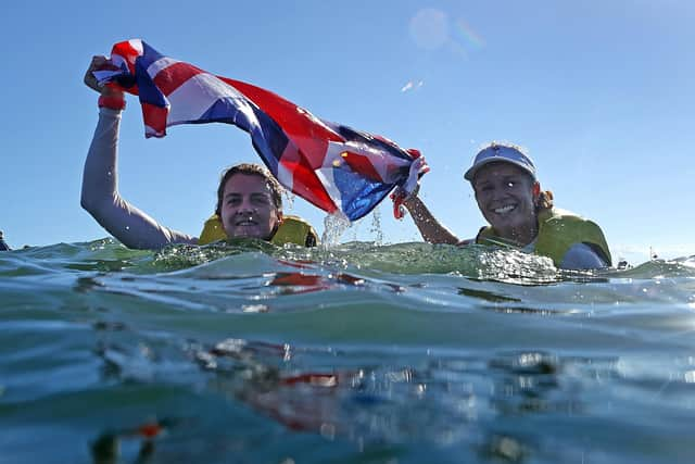 Eilidh McIntyre, left, and Hannah Mills celebrate their Olympic gold medal win. Photo by Clive Mason/Getty Images.