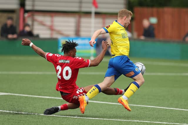 Tommy Wright is challenge during the 0-0 draw at Hemel Hempstead. Picture by Dave Haines.
