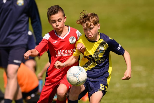 Action from the Clanfield youth football tournament at Horndean Technology College. Picture: Keith Woodland (270521-245)