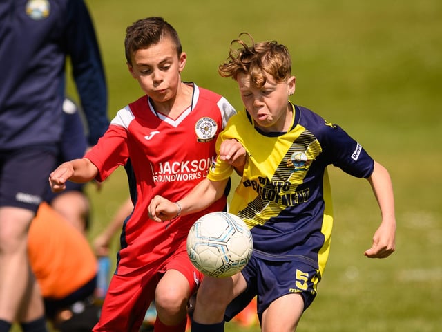 Action from the Clanfield youth football tournament at Horndean Technology College. Picture: Keith Woodland (270521-245)