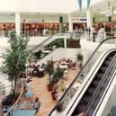 The escalators leading down to the food court, with long-lost shops such as Adams and Intersport on the level above