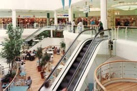 The escalators leading down to the food court, with long-lost shops such as Adams and Intersport on the level above