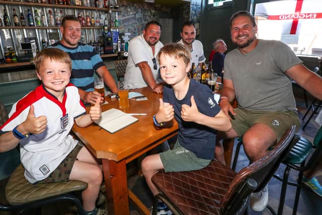 England Fans watching England V Croatia at The Shepherds Crook pub. Twins Jude and Lenny Wright, 8, from Southsea with Charlie Davies, Ryan Long, Phil Barta and Michael Whitelock.
Picture: Stuart Martin (220421-7042)