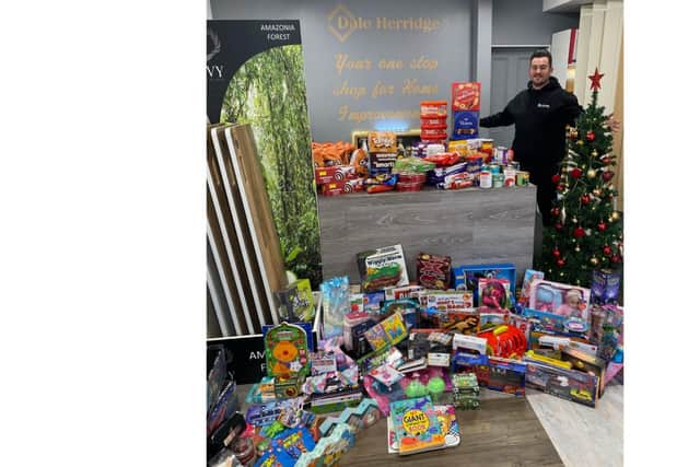 Dale Herridge with the toys and food collected for Crisis Food Gosport. Picture: Dale Herridge Home Improvements