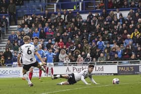 Michael Jacobs fires home a 70th-minute equaliser to cap Pompey's comeback in the 2-2 draw with Port Vale. Picture: Barry Zee