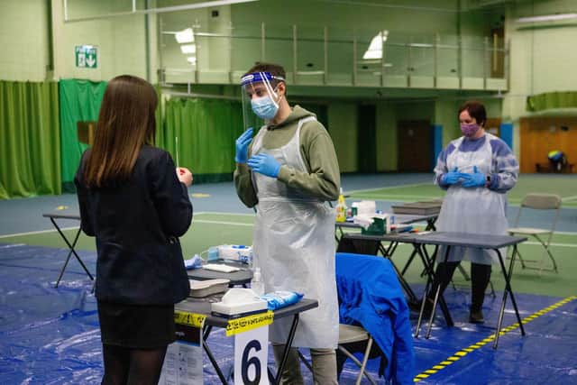 Ava Errington-Noden, 15, having a Covid test in the hall of Portsmouth's Priory School on Monday  Picture:  Habibur Rahman