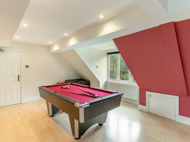 A large games room currently occupies the space of what could serve as the seventh bedroom if required, or alternatively could be transformed into an additional reception room or home office.