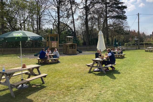 The beer garden and play equipment at The Cricketers Inn.