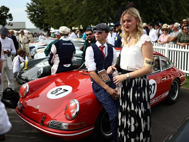 Mechanics prepare classic cars ahead of a race during the opening day of Goodwood Revival at the Goodwood Motor Circuit in Chichester on September 8, 2023. The only historic motor race meeting to be staged entirely in a period theme, Goodwood Revival is an immersive celebration of iconic cars and fashion.