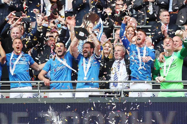 Brett Pitman lifts the Checkatrade Trophy aloft at Wembley last season. Picture: Joe Pepler