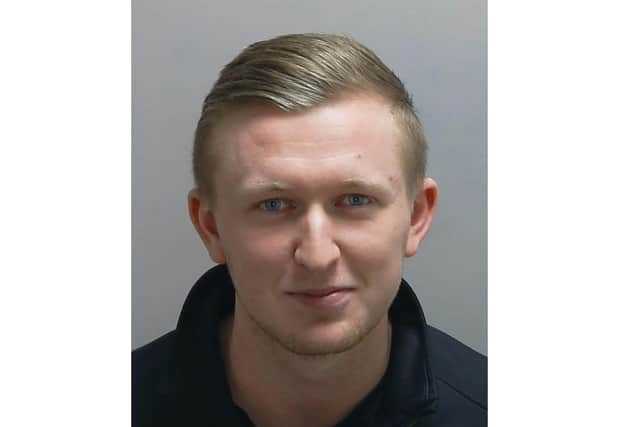 Smirking, Bradley David Young, 24, of Forest End is pictured in custody for stealing almost £200,000 from a care firm. Today he has been jailed for six years.Photo: Hampshire police