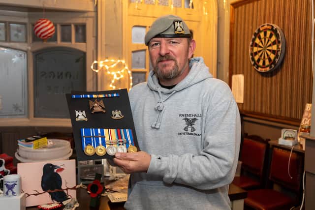 Ravens Halls founder Kris Darling (43) with his medals. Picture: Mike Cooter (111221)