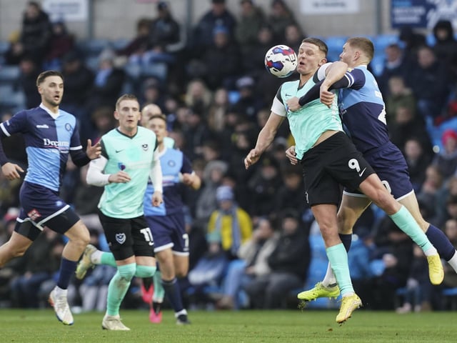 Colby Bishop battles to keep possession from Wycombe's Alfie Mawson at Adams Park. Picture: Jason Brown/ProSportsImages