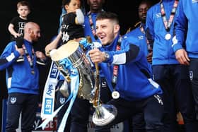 Conor Chaplin celebrates winning League Two with Pompey. Picture: Joe Pepler