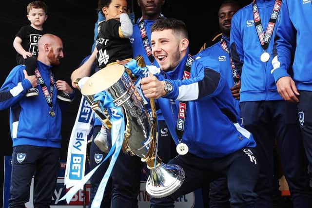 Conor Chaplin celebrates winning League Two with Pompey. Picture: Joe Pepler