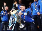 Conor Chaplin celebrates winning League Two with Pompey. Picture: Joe Pepler