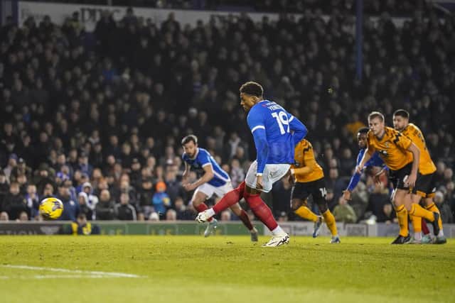Kusini Yengi draws Pompey level from the penalty spot against Cambridge United. Picture: Jason Brown