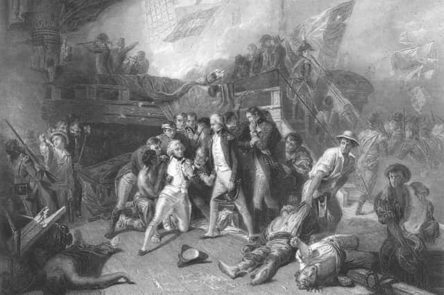 Admiral Lord Horatio Nelson lays mortally wounded on the quarterdeck of his flagship the HMS Victory at the Battle of Trafalgar fought between the Royal Navy and the combined fleets of France and Spain during the Napoleonic War of the Third Coalition on 21 October 1805 off Cape Trafalgar, Spain. An engraving by William Greatbach after an original painting by Ernest Slingeney. (Photo by Hulton Archive/Getty Images)