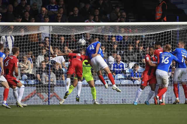 Clark Robertson heads home Michael Jacobs' second-half corner in Saturday's 3-1 success over Gillingham. Picture: Barry Zee