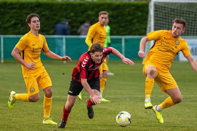 Connor Messenbird (red) was sent off on an action-packed evening for Fareham at home to Alresford in the Wessex League Premier Division. Picture: Vernon Nash
