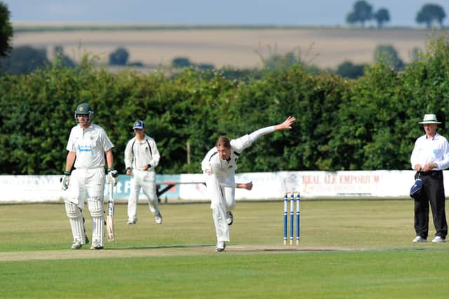Panoramic - Southern Cricket League action at Hambledon's Ridge Meadow ground. Hambledon bowler is Rupert Hetherington. Picture:  Malcolm Wells