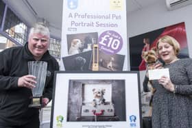 Gosport Photographer Steve Reid (left) with customer Patricia Hume and her Yorkie Myla. This portrait won former News photographer Steve the Pet Portrait Photographer of the Year and the UKPP National Portrait Awards and Patricia a cheque for £1000.
