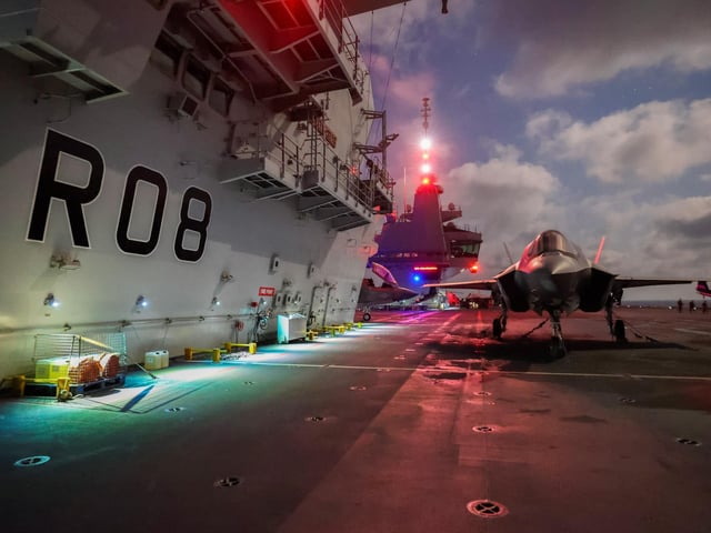 An F35B Lightning Jet on the flight deck of HMS Queen Elizabeth during the replenishment.