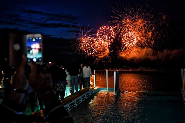 Fireworks light up the sky off Iona, the ship’s namesake isle.