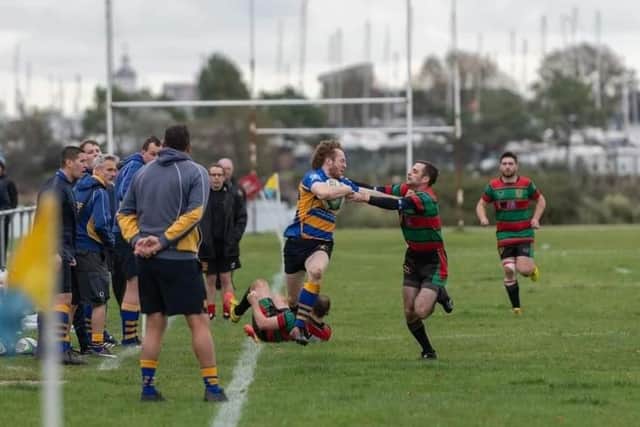 Double try scorer Ben Smith, left, breaks away from a Millbrook tackle. Picture: Martin Burnett