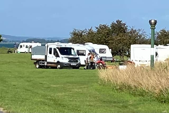 Travellers pictured at Milton Common on Thursday evening.
