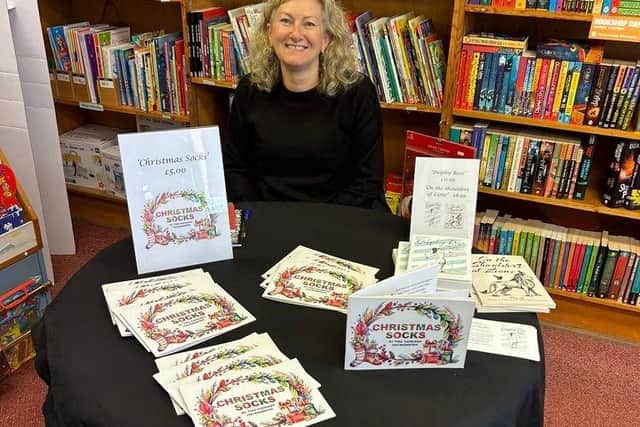 Tina Cathleen MacNaughton with her latest children's festive story book 'Christmas Socks'