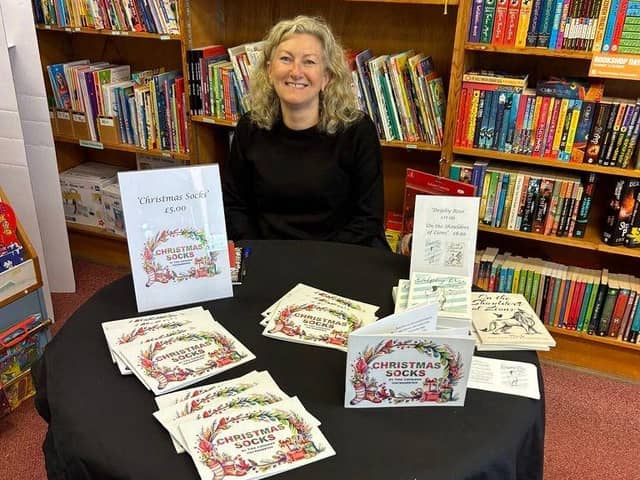 Tina Cathleen MacNaughton with her latest children's festive story book   'Christmas Socks'