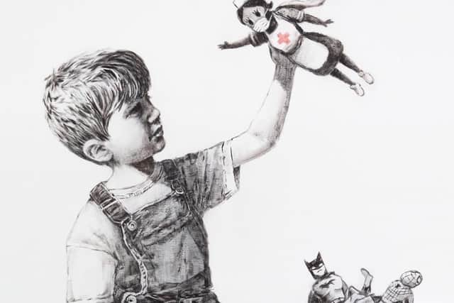 Handout image issued by the Instagram page of @banksy of a new artwork painted by Banksy during lockdown, which has gone on display in a hospital corridor. The piece, entitled Game Changer, is now on view to staff and patients on Level C of Southampton General Hospital. credit: @banksy/Instagram/PA Wire