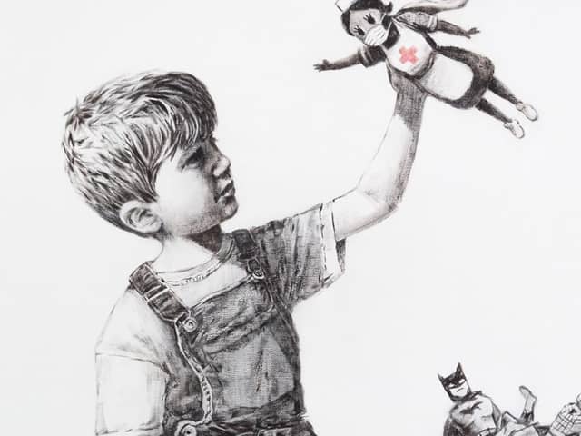 Handout image issued by the Instagram page of @banksy of a new artwork painted by Banksy during lockdown, which has gone on display in a hospital corridor. The piece, entitled Game Changer, is now on view to staff and patients on Level C of Southampton General Hospital. credit: @banksy/Instagram/PA Wire