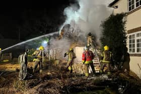 Firefighters tackle thatch fire near Romsey. Pic Hants fire and rescue