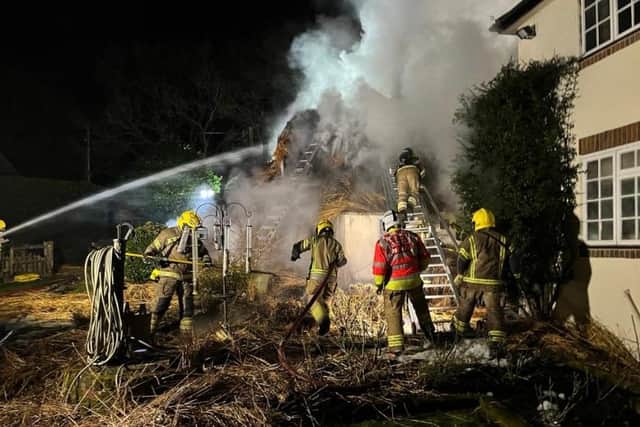 Firefighters tackle thatch fire near Romsey. Pic Hants fire and rescue
