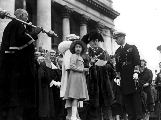 The Queen as an 11-year-old with her father King George VI in Guildhall Square during a visit to Portsmouth in June 1937. The News PP757